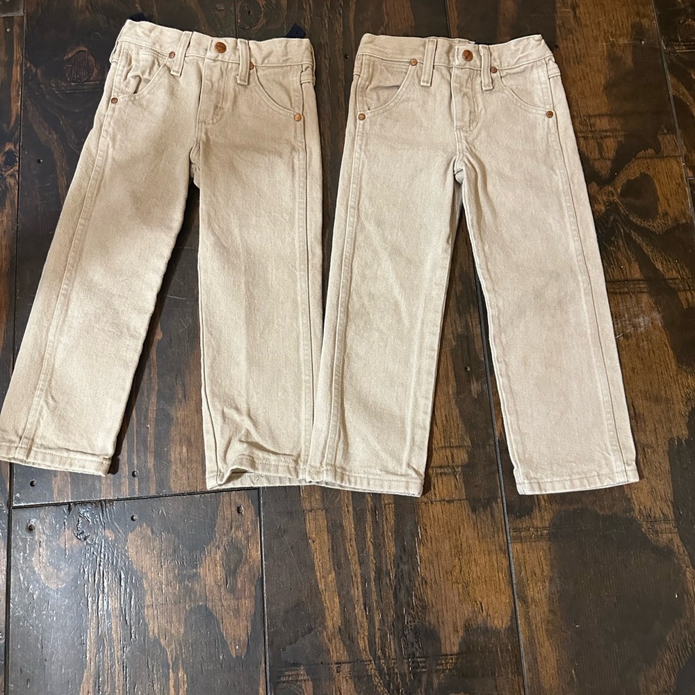 Kids wrangler khakis x2 one with discoloration on the knees as pointed out